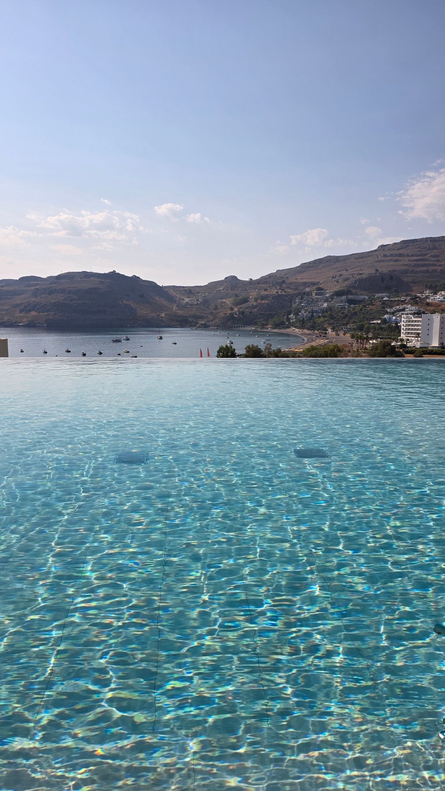 View from the hotel: pool and the beach close to Lindos